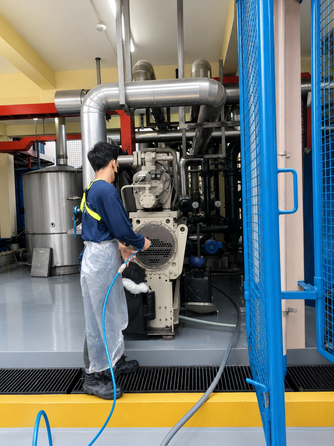 Technician descaling a chiller condenser tube