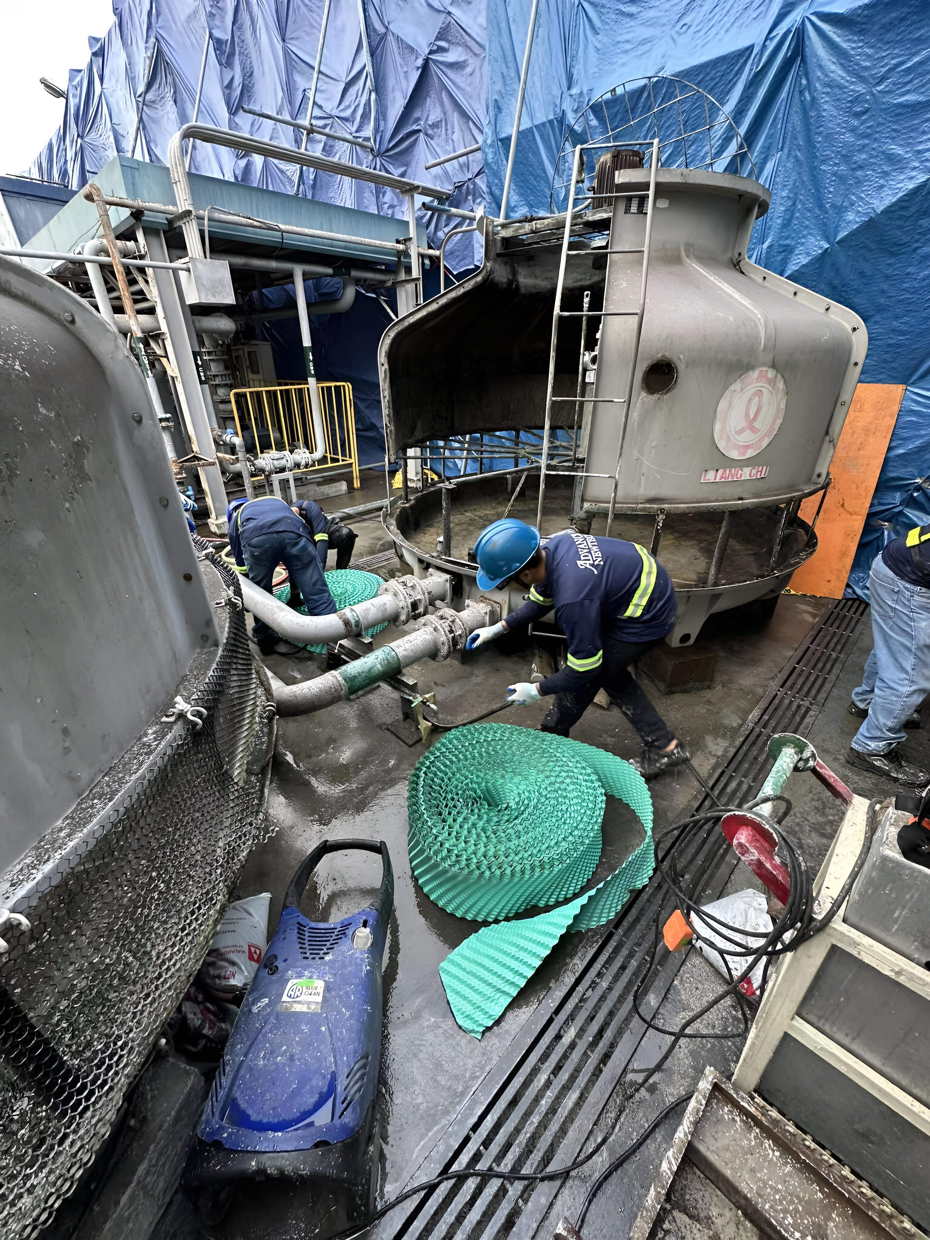 Cooling tower filler cleaning and industrial water treatment system maintenance