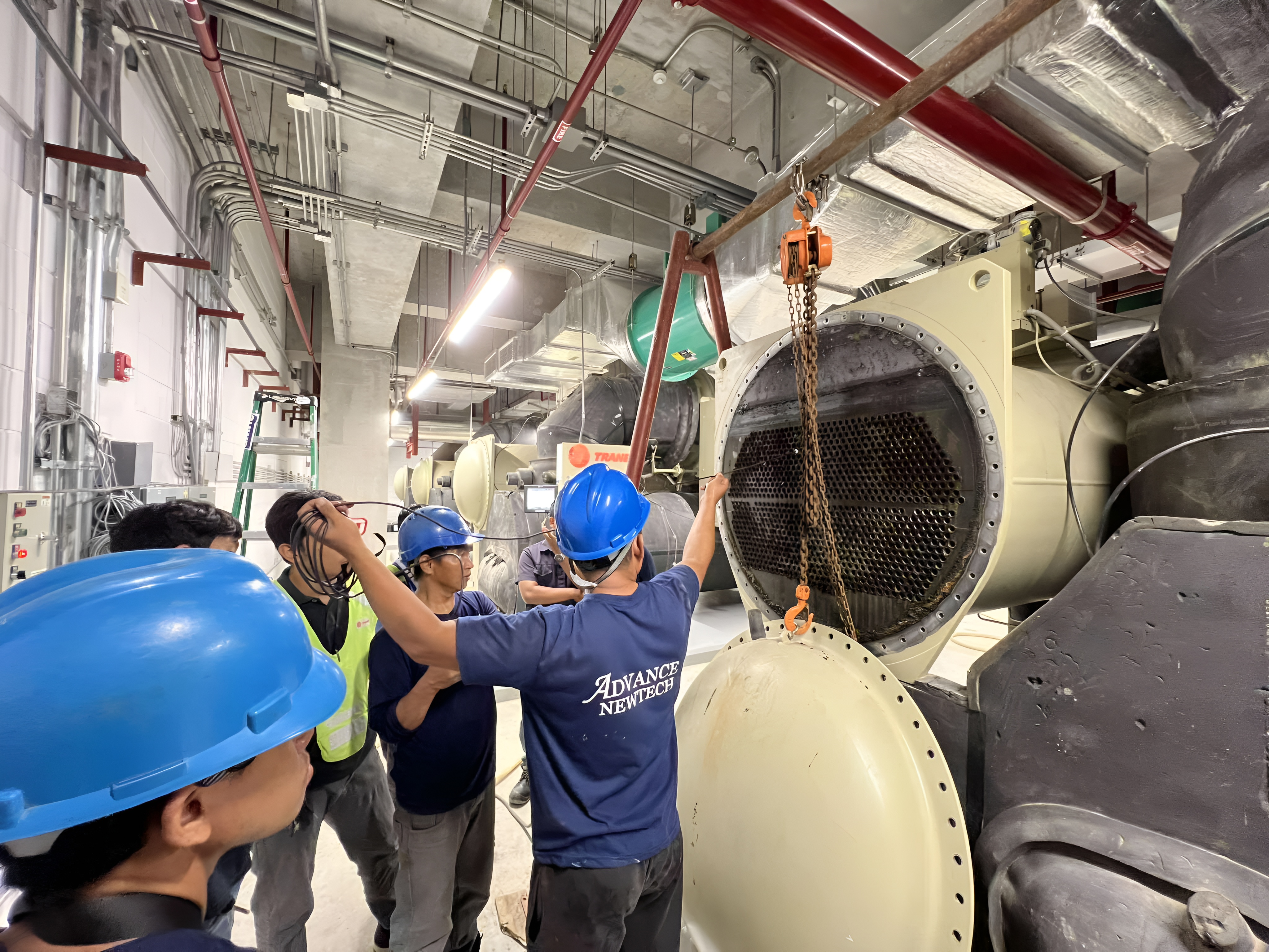 Industrial descaling service for cooling system performance restoration