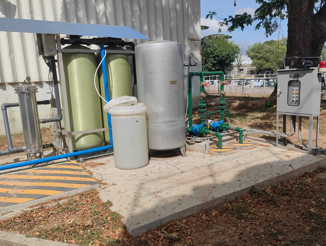 Technician monitoring boiler water treatment system